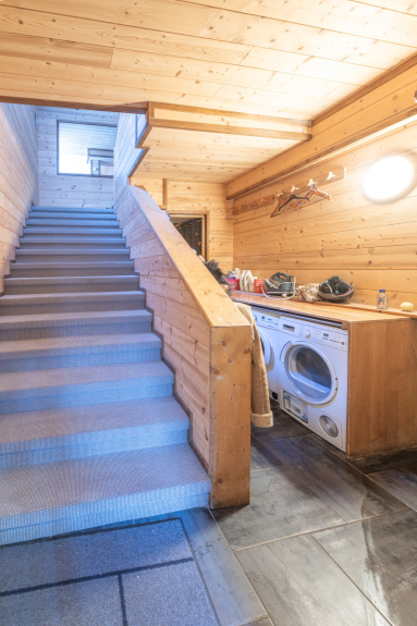 Entrance hall with laundry room, cloakroom, washing machine and tumble dryer.