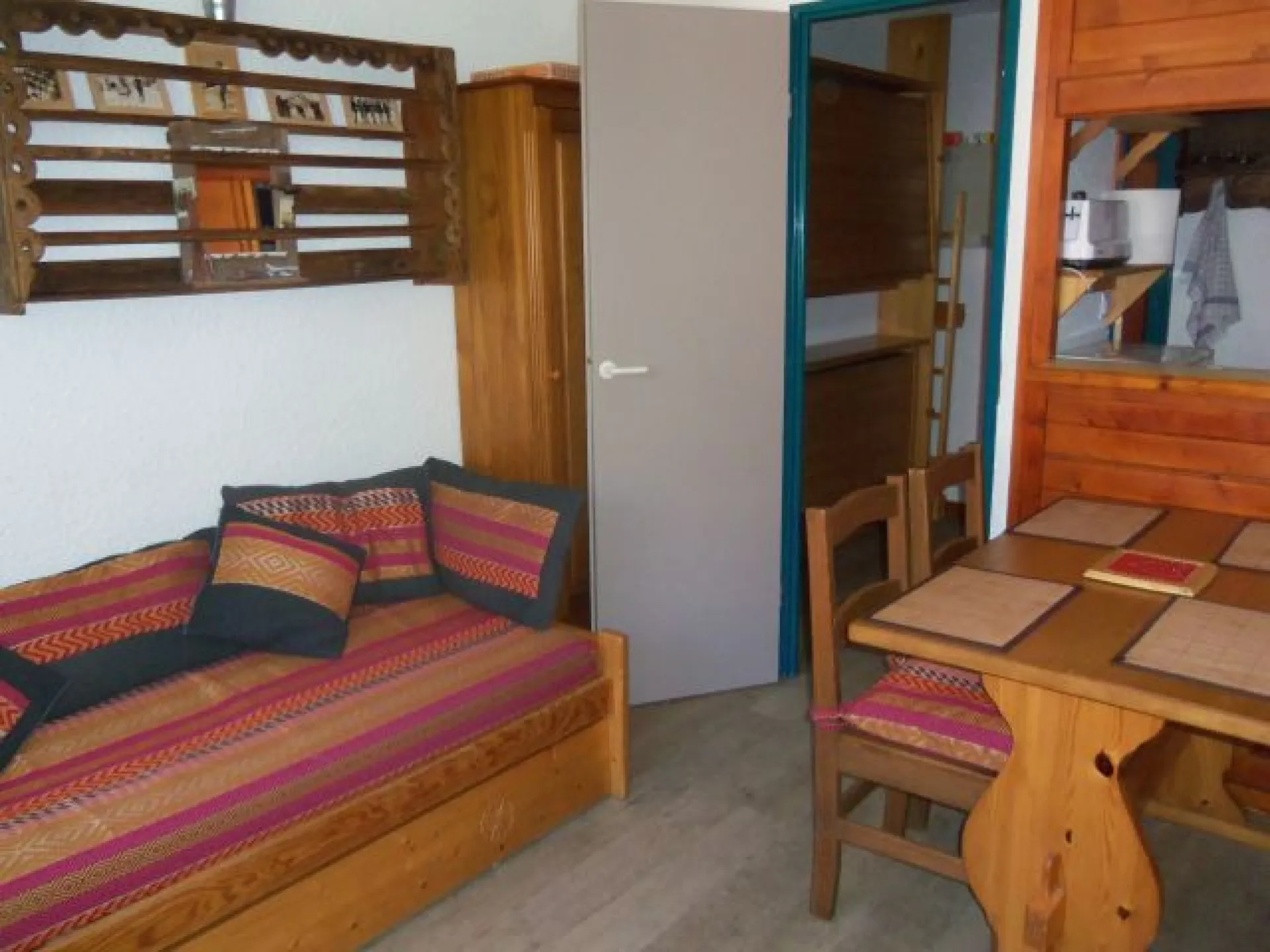 Living room with sofa bed and dining area