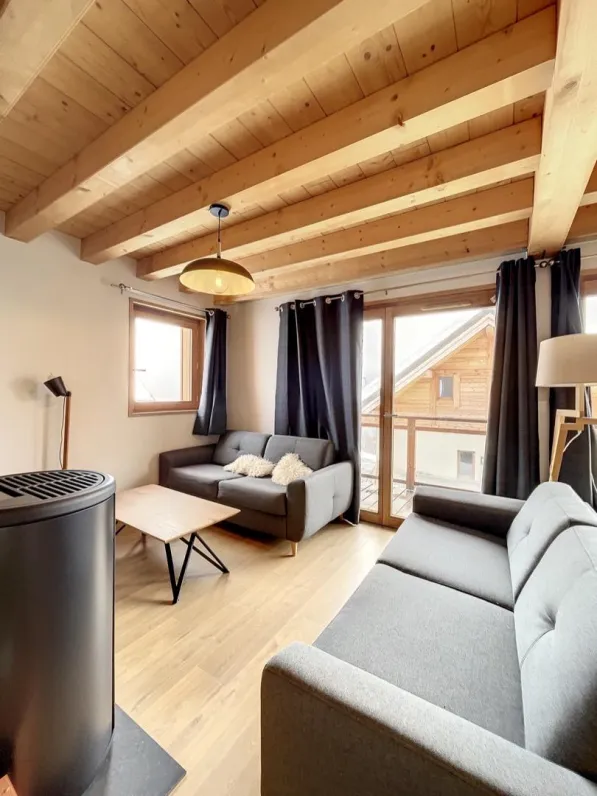 Living-room with television and a stove.