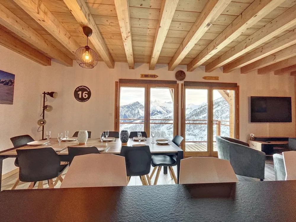 Living room with large window openings.