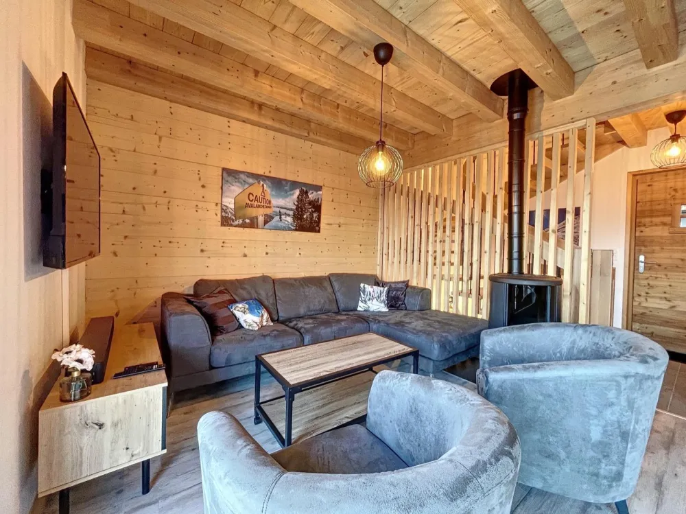 Living room with television and stove.