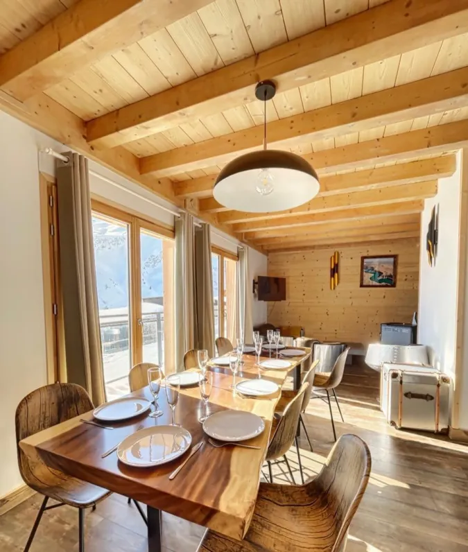 Dining room with a large wooden table.