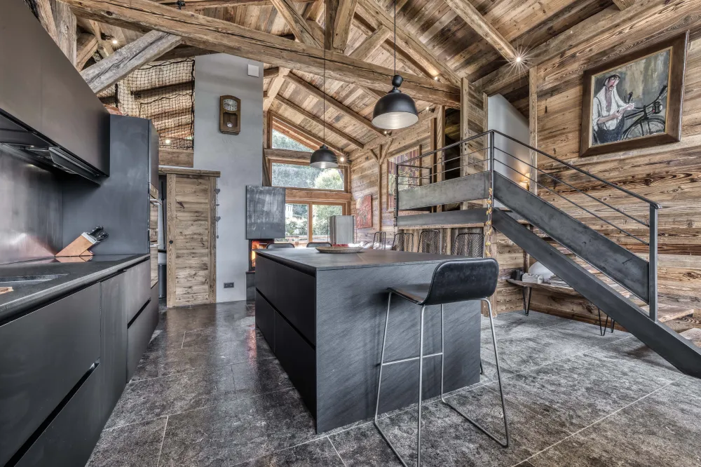 Open kitchen fully equipped with refrigerator, freezer, dishwasher, washing machine, microwave, traditional oven, utensils, glasses, pots, fondue and raclette kids, and storage space
