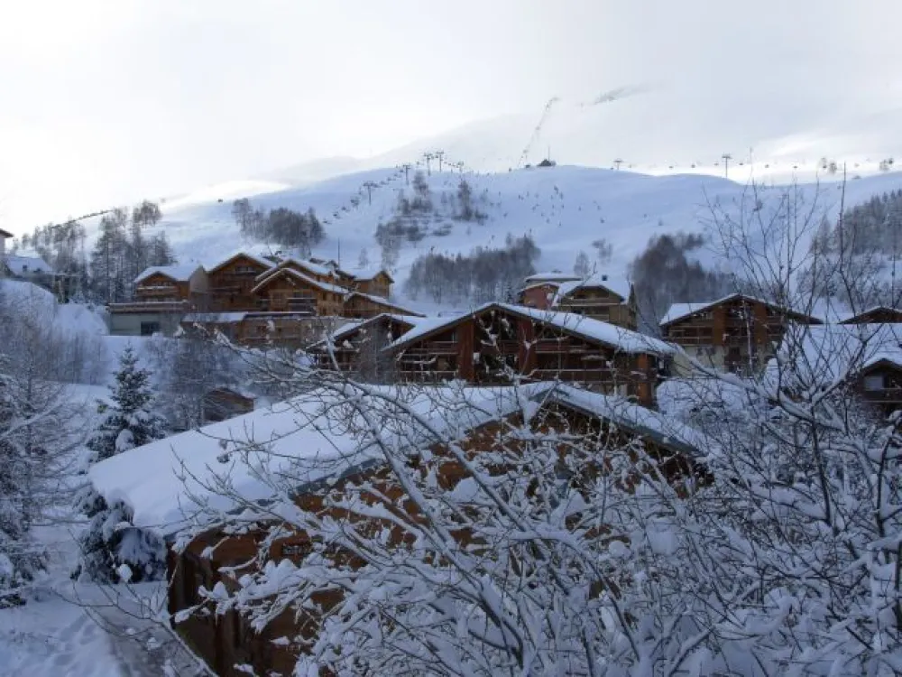 CHALET SEEN FROM THE ENTRANCE DOOR SIDE 
QUIET ENVIRONMENT AND SPACE AROUND THE CHALET ; THE GARDEN ( PINE-TREES)IS SITUATED ALONG A SKI SLOPE LEADING TO SKI-LIFTS IN 3 MINUTES
