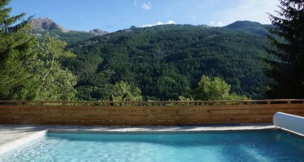 From the pool terrace overlooking Serre Chevalier and the new gondola Chantemerle, just opposite