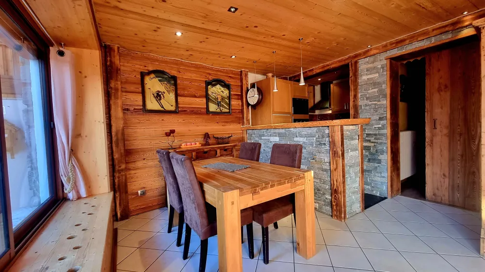 Dining room with open-plan kitchen.