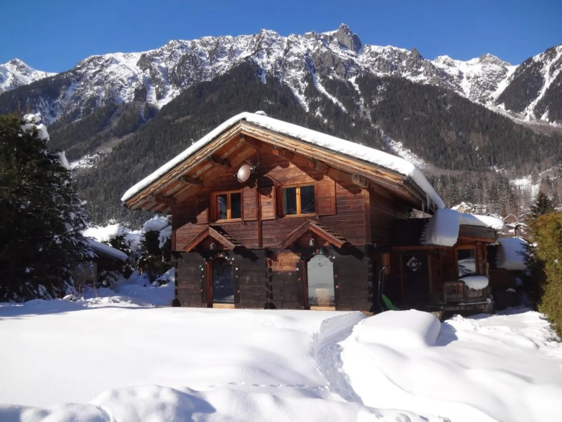 Old typical chalet,full south, located at the corner of the big garden.Behind you can see the top of the Brévent