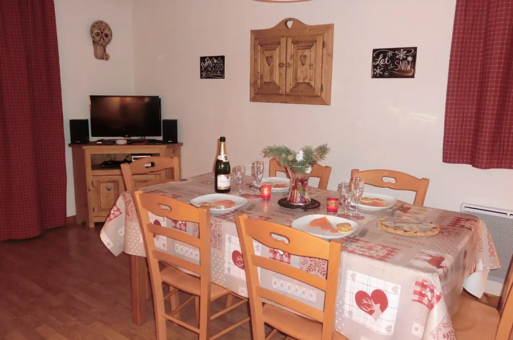 The living-room: table and chairs for 8
TV, DVD player, radio and CD player with Bluetooth and USB