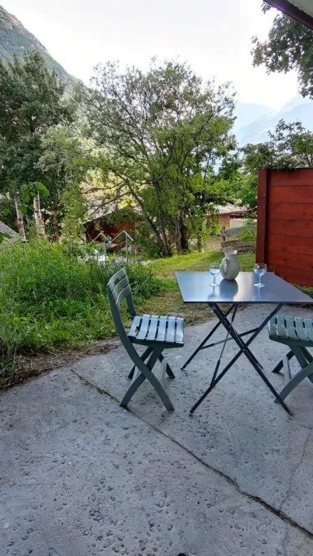 Table, chairs and deck chair.