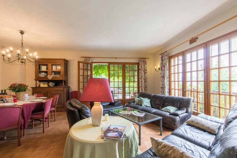 the bright summer living room opening onto the terrace