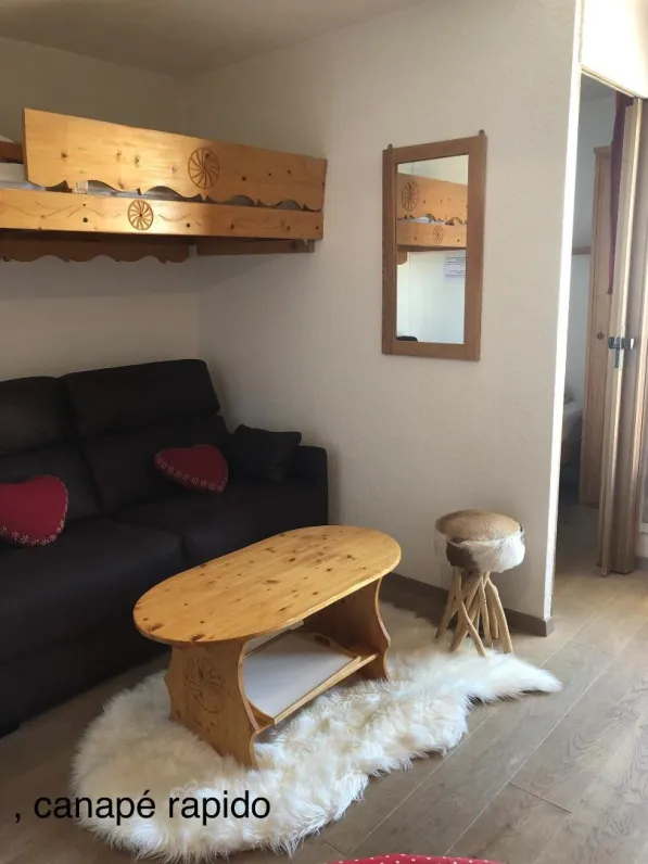 rapido sofa with the door of the room to the right of the image .