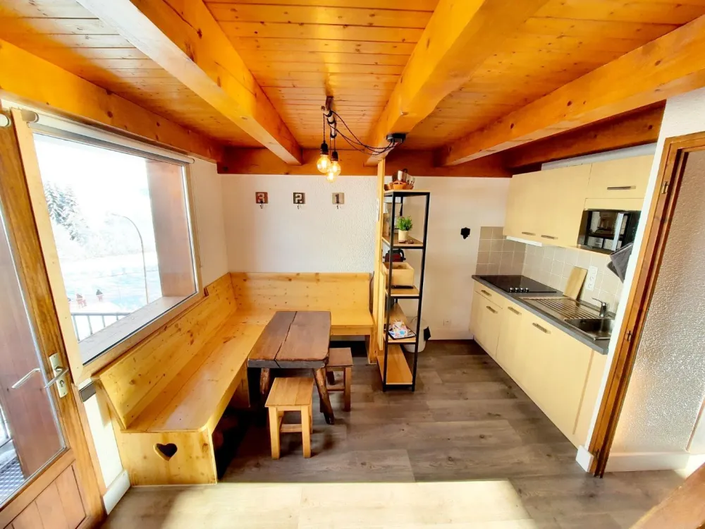 Integrated kitchen with seating area and games TV