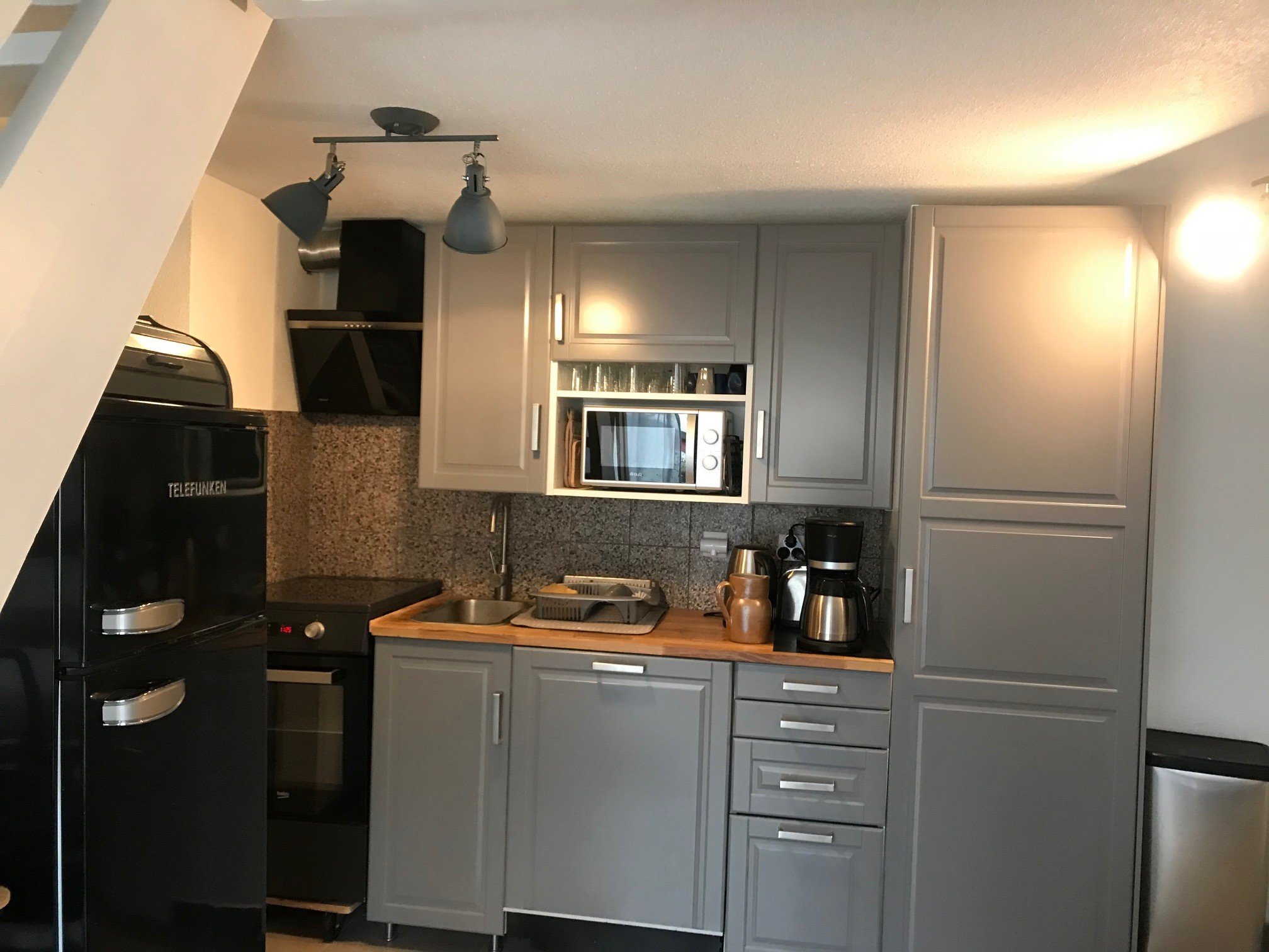 Séjour avec cuisine américaine équipée