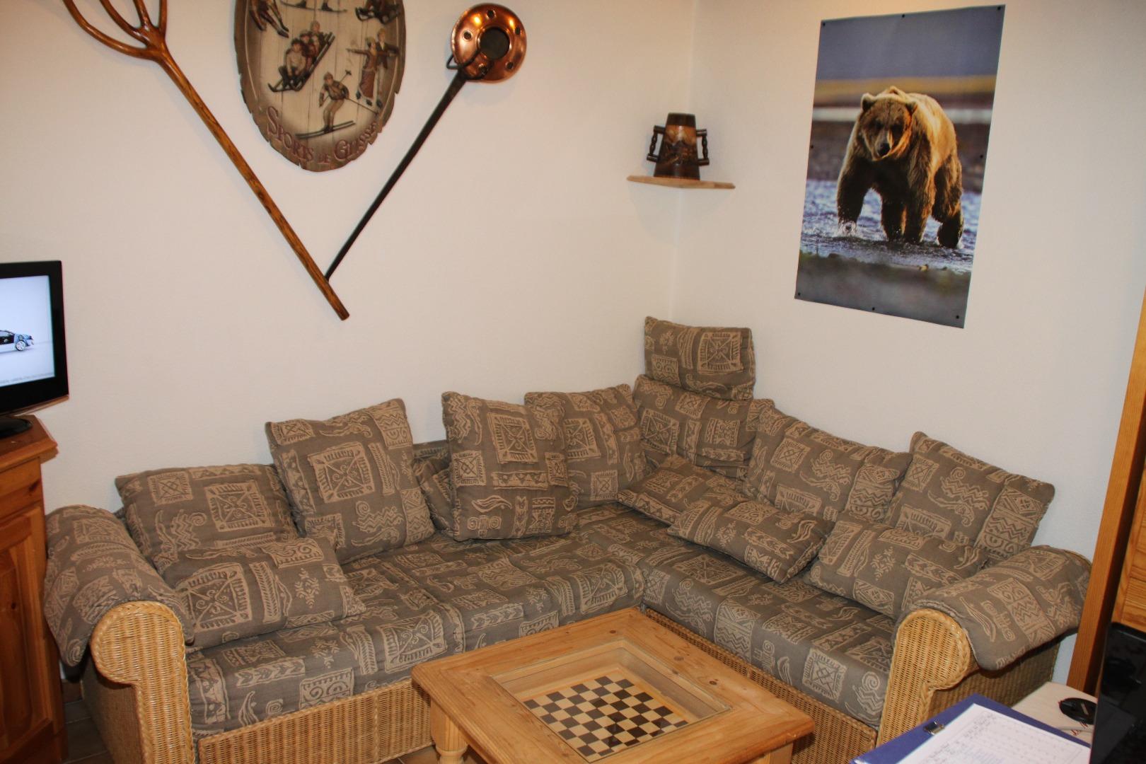 Le coin salon avec un canapé gigogne de 120 cm