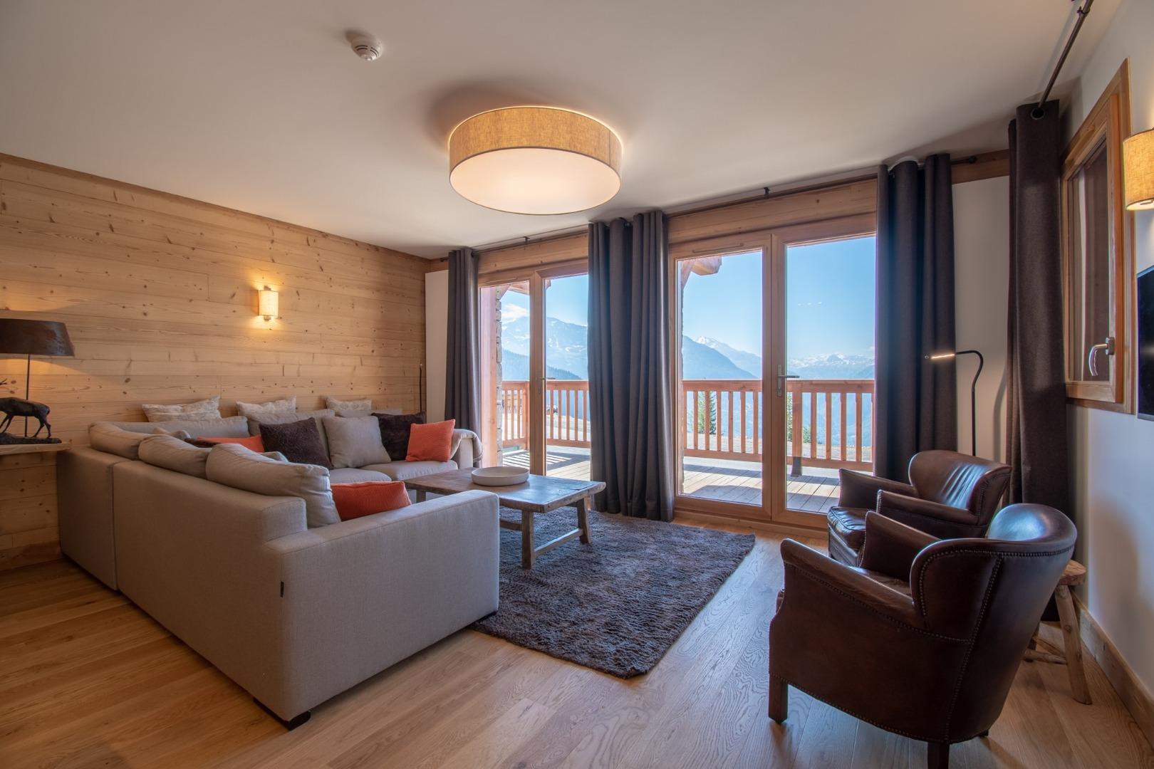 Chalet GRIVOLA Appart Myrtilles 130m², full services 4*, 4 chbr, 3 sdb/d, grande terrasse Sud et 2 parkings
